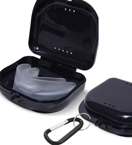 Black retainer cases, one open showing how a guard sits inside, one closed with a carabiner clip